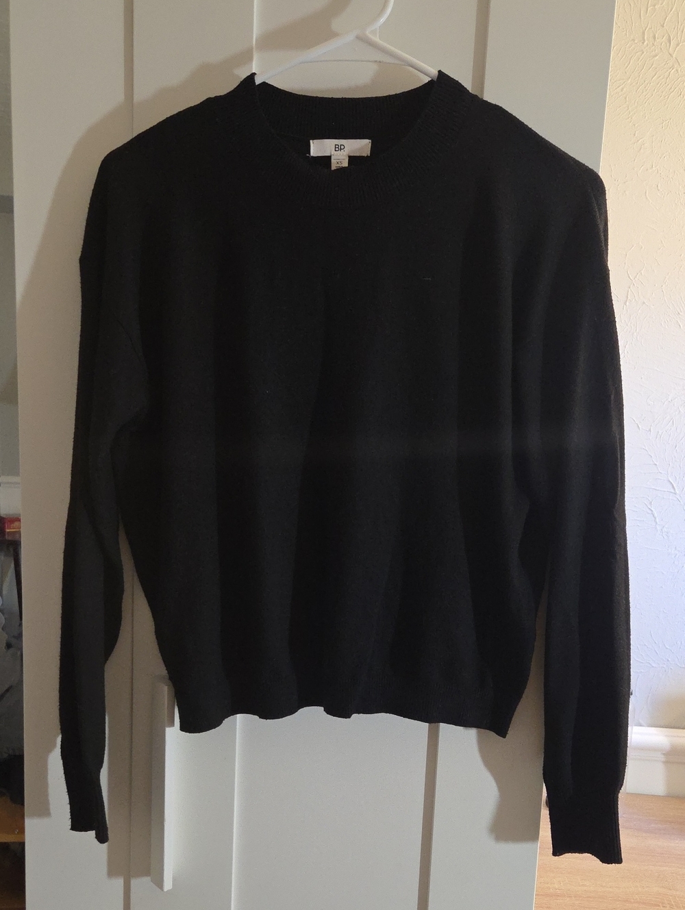 Plain black crewneck sweater